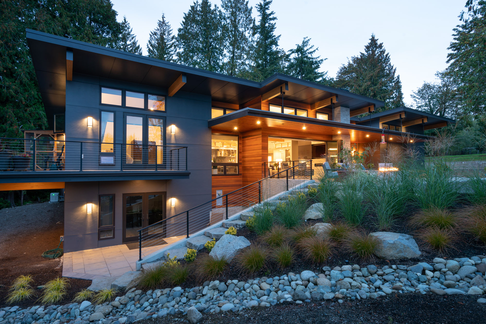 Fifth slide - Modern home in Redmond Washington with a fir beam canopy in a terraced landscape